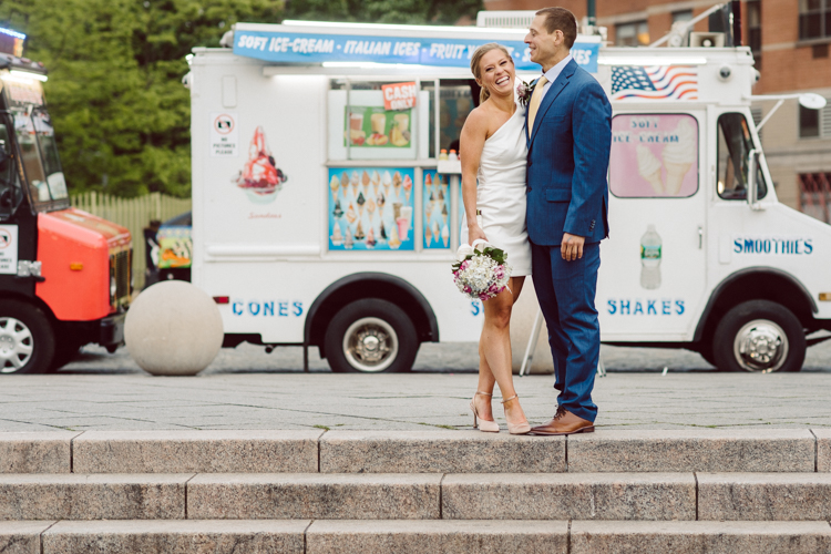 Colleen and Patrick had an intimate wedding ceremony at their church in Queens, NY then we went over to Gantry Plaza State Park LIC for their wedding photos. Colleen and Patrick's NYC elopement was nothing but fabulous and spectacle. When I saw all the food trucks lined up along Gantry Plaza State Park I knew I wanted to use it as our backdrop for Colleen and Patrick. Of course we chose "Mr Softee's Ice Truck" and as we were taking the photo one of Colleen and Patrick's cousin walked by doing the most epic photobomb ever! Colleen and Patrick's NYC elopement Gantry Plaza State Park LIC captured by NY NJ Weddings, Elopements and Family Photographer Karis by Hey Karis.